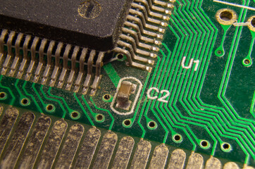 dusty printed circuit Board with components . macro