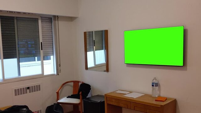 Green Screen Television in a Room. You can replace green screen with the footage or picture you want. You can do it with “Keying” effect in After Effects or any other video editing software.