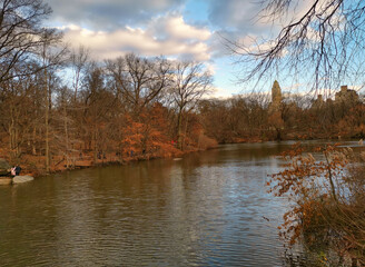 Fototapeta na wymiar The central park, New York city daylight view with people walking, new York skyline , clouds and trees