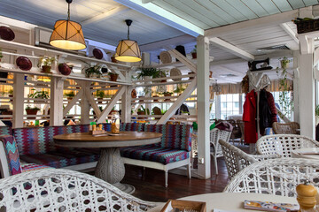 Interior of a modern cozy italian restaurant. Summer terrace