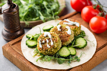 Vegetarian tortilla with falafel and vegetables and yogurt sauce