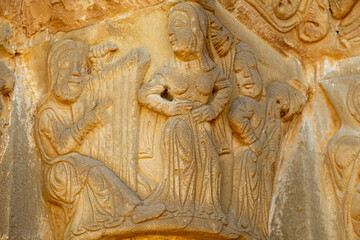 dancer between two musicians, Church of Santiago de Agüero, Agüero, Huesca, Spain