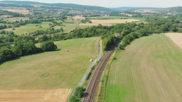 inter city express train cutting through countryside