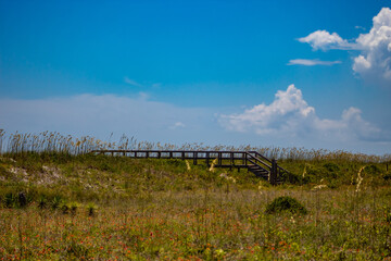 Fototapeta na wymiar Beach landscape with wooden walkway
