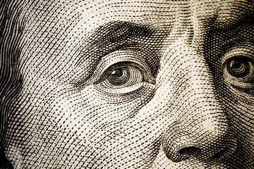 Portrait of American politician Benjamin Franklin on a hundred-dollar bill, maximum close-up....