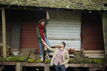 Young person in casual wear holding hand of human