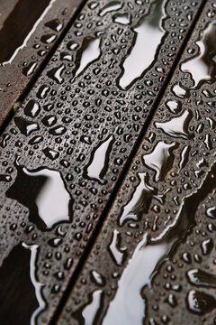 Water beading up on Hardwood Deck after Rainstorm