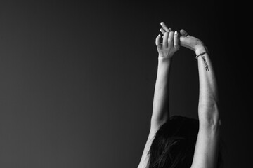 Black-white silhouette of young woman.