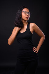 Naklejka premium Portrait of young beautiful Asian woman with eyeglasses