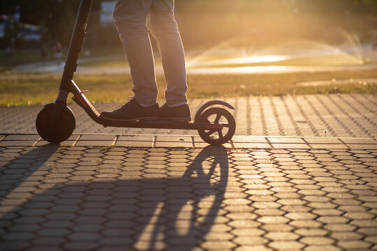 Detail shot of man riding a scooter