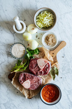 Ingredients for Osso Bucco dish on kitchen table