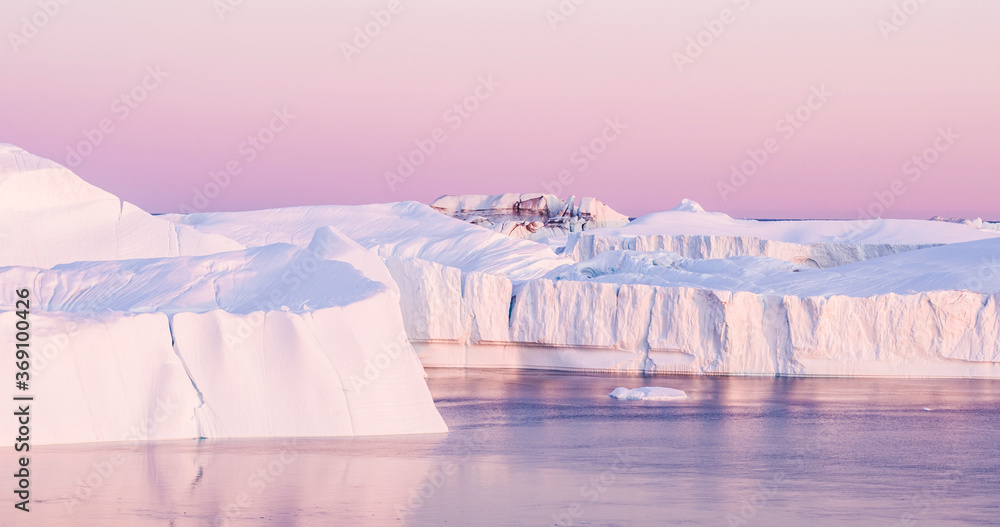 Wall mural climate change. iceberg and ice from glacier in arctic nature landscape on greenland. aerial image d
