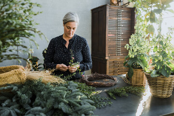 Woman Florist Assembling a Garland