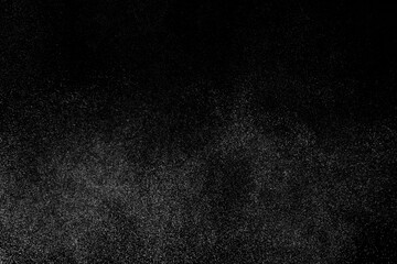 Fototapeta premium Abstract splashes of water on black background. Freeze motion of white particles. Rain, snow overlay texture.