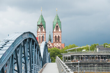 View of the Herz Jesu Church and the Wiwili Brücke bridge in Freiburg im Breisgau, Germany