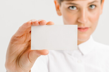  close-up portrait of a young businesswoman with Blank Business Card