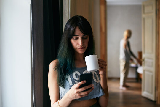 Girl Drinking Coffee And Surfing Internet