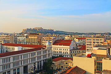 Ariel view of the Acropolis and Business District of Athens, Greece with red roofs and blue sky copy space.