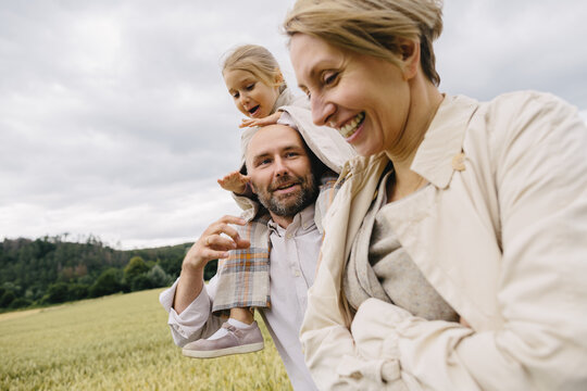 Mom, dad and little girl