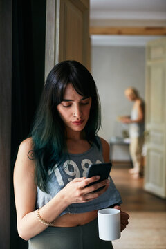 Woman Reading Messages On Smartphone