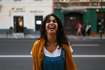 portrait of a Joyful and happy young woman laughing