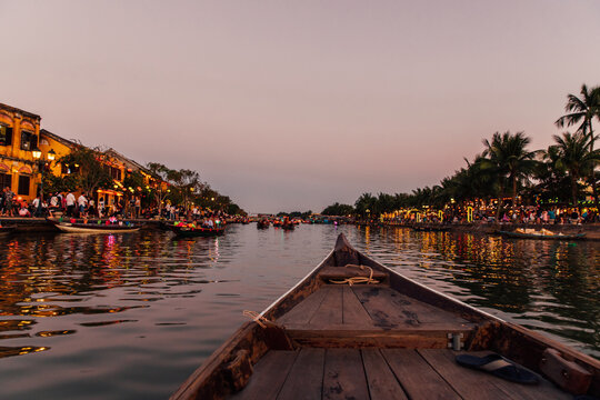 Traditional Boat Floating Down the Thu Bon River in Hoi Am
