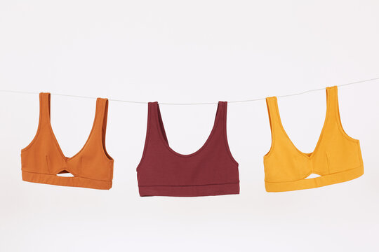 Three Comfy Bras On Clothesline