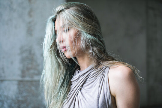 Sculptural portrait of a beautiful woman with blue hair