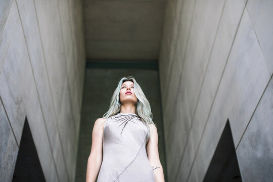 Sculptural portrait of a beautiful woman with blue hair approaching