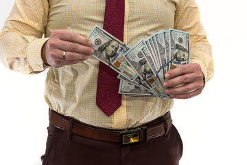 Businessman counts money isolated on white. A man in a suit is making a profit or a win. Account of dollars. Wealth concept.