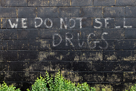 Painted sign deterring the selling of drugs