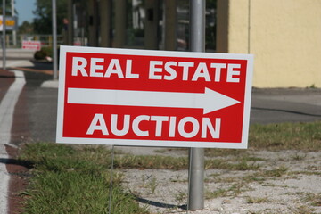Real Estate Auction Sign. Economic Downturn during Layoffs and Pandemic lead to people losing there homes because they cannot pay the mortgage to the bank.