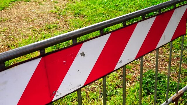 metal barriers with red decorations for greater evidence, used to mark off interrupted roads and detours or stem the crowds
