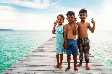 Portrait of three children looking at camera