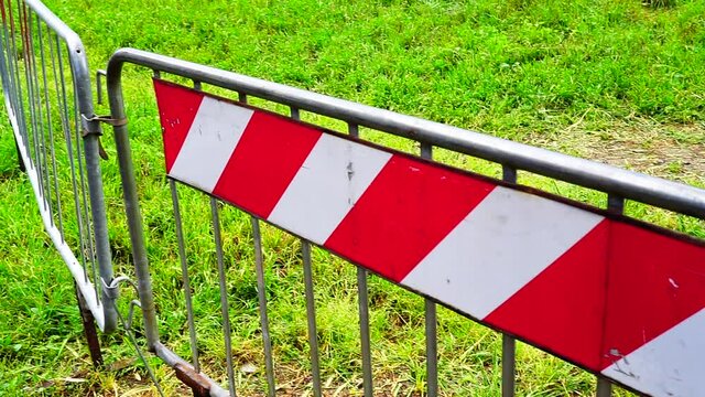 metal barriers with red decorations for greater evidence, used to mark off interrupted roads and detours or stem the crowds