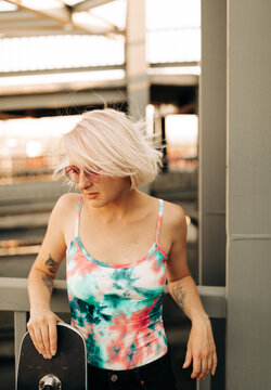 woman with longboard outdoors