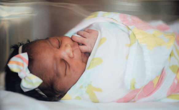 Mom holding newborn at hospital