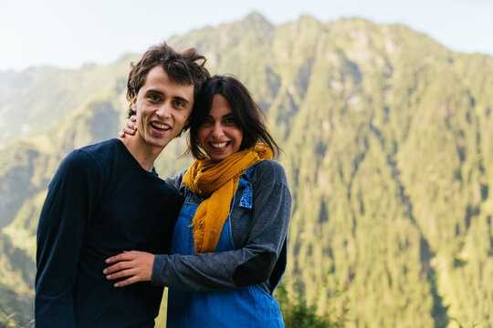 Two brothers smiling and looking at the camera at lookout