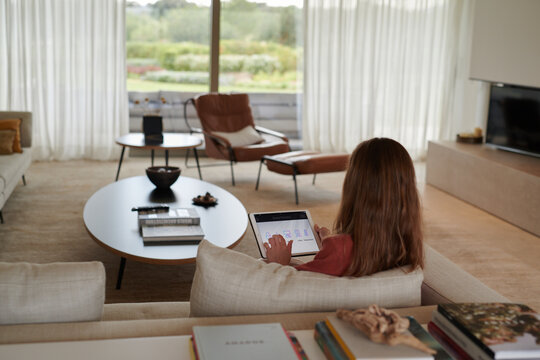 Girl using tablet at home