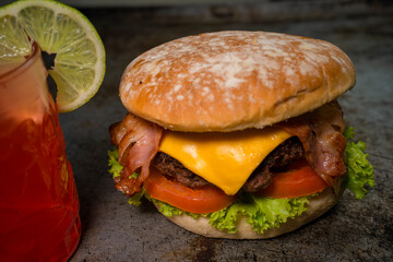 Tasty burger on rustic background
