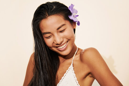 Woman Smiling Eyes Closed with Flower