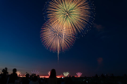Beautiful Fireworks with Some Silhouettes in Japanese Summer Season