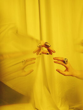 Hands of anonymous people with luxury jewel. Mobile photo