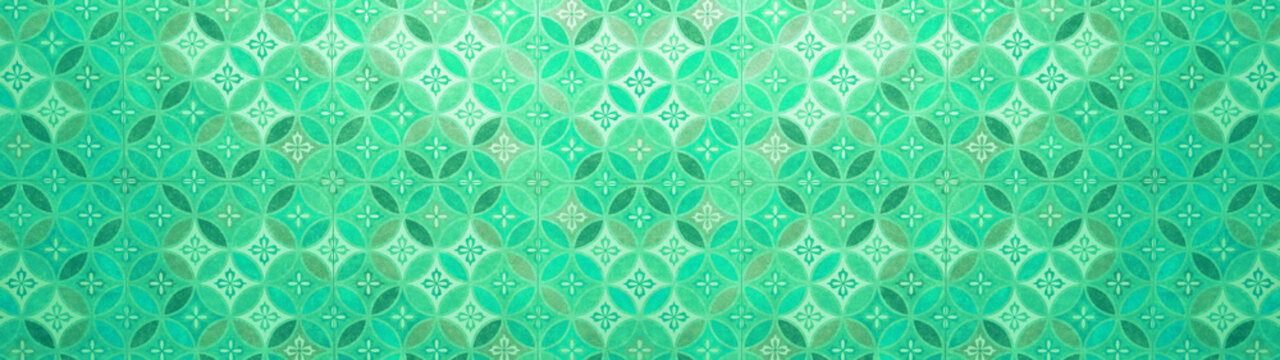 Old green pastel vintage shabby patchwork mosaic motif tiles stone concrete cement wall texture background with circle print
