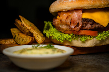 Tasty burger on rustic background