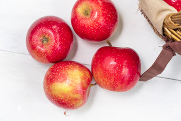 red juicy fresh apples on wooden background. view from above