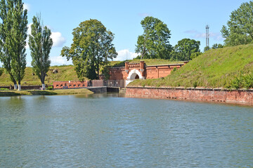 Fototapeta na wymiar View of the Pillau fortress-citadel and a moat with water. Baltiysk, Kaliningrad region
