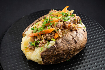 baked potato on the black background