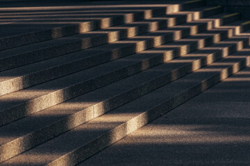 Sunlight on gray stone stairs