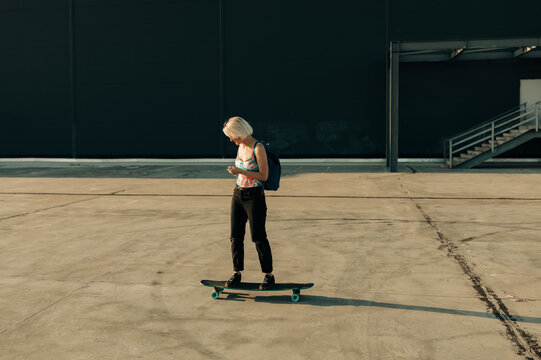 Real Woman With Longboard Outdoors